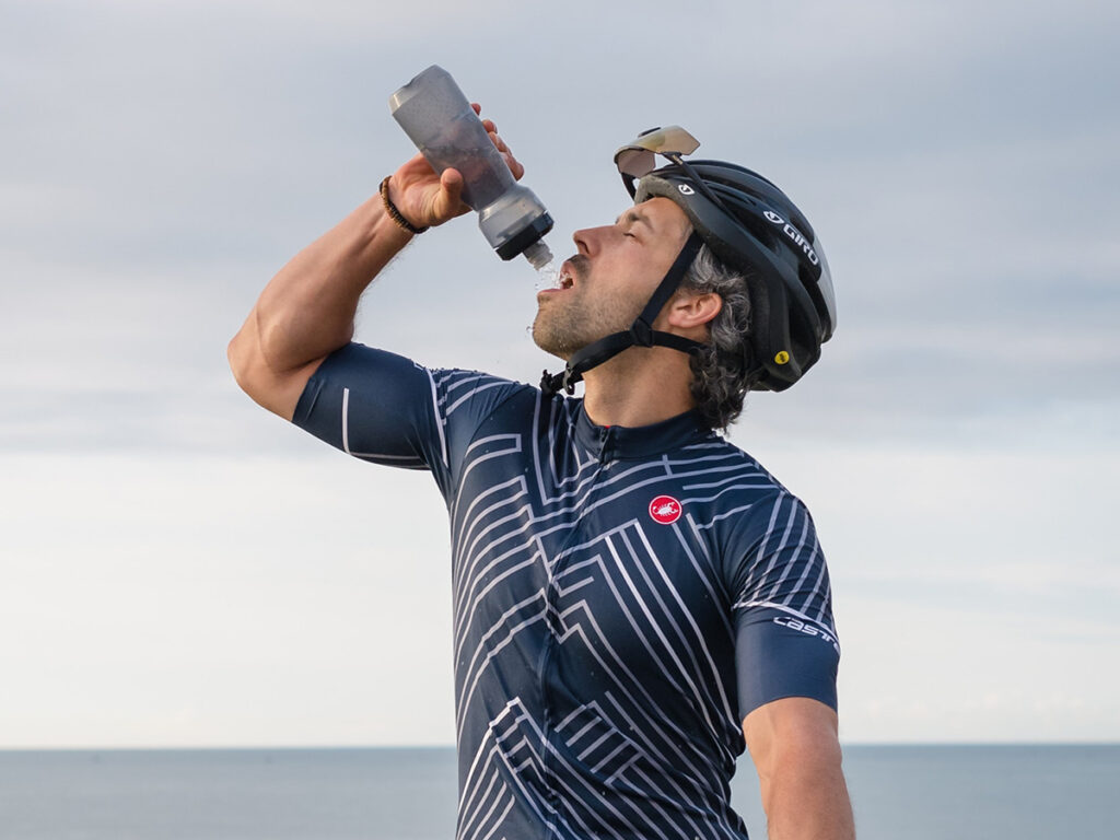 bicyclist drinking water after a long ride